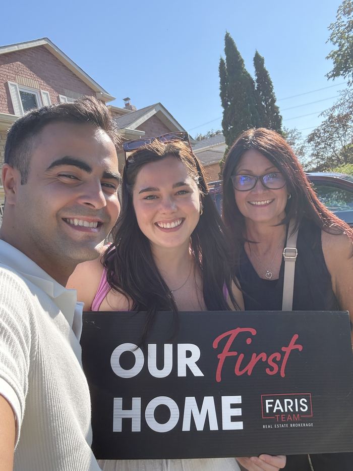 Clare and Mark with their Realtor on closing day